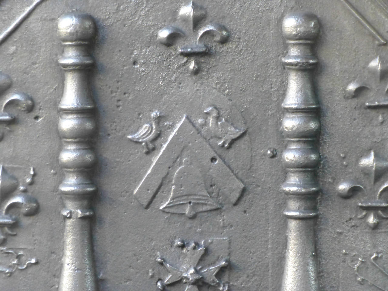 With unknown arms, pillars of Hercules, fleurs de lys (symbol of royalty), and other symbols such as pipes.