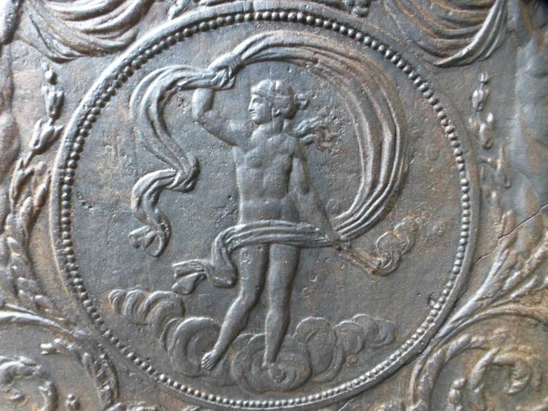 18th century French fireback with Venus, goddess of love, with the torch of Hestia, the wife of Zeus, goddess of family life.

We have a unique and specialized collection of antique and used fireplace accessories consisting of more than 1000