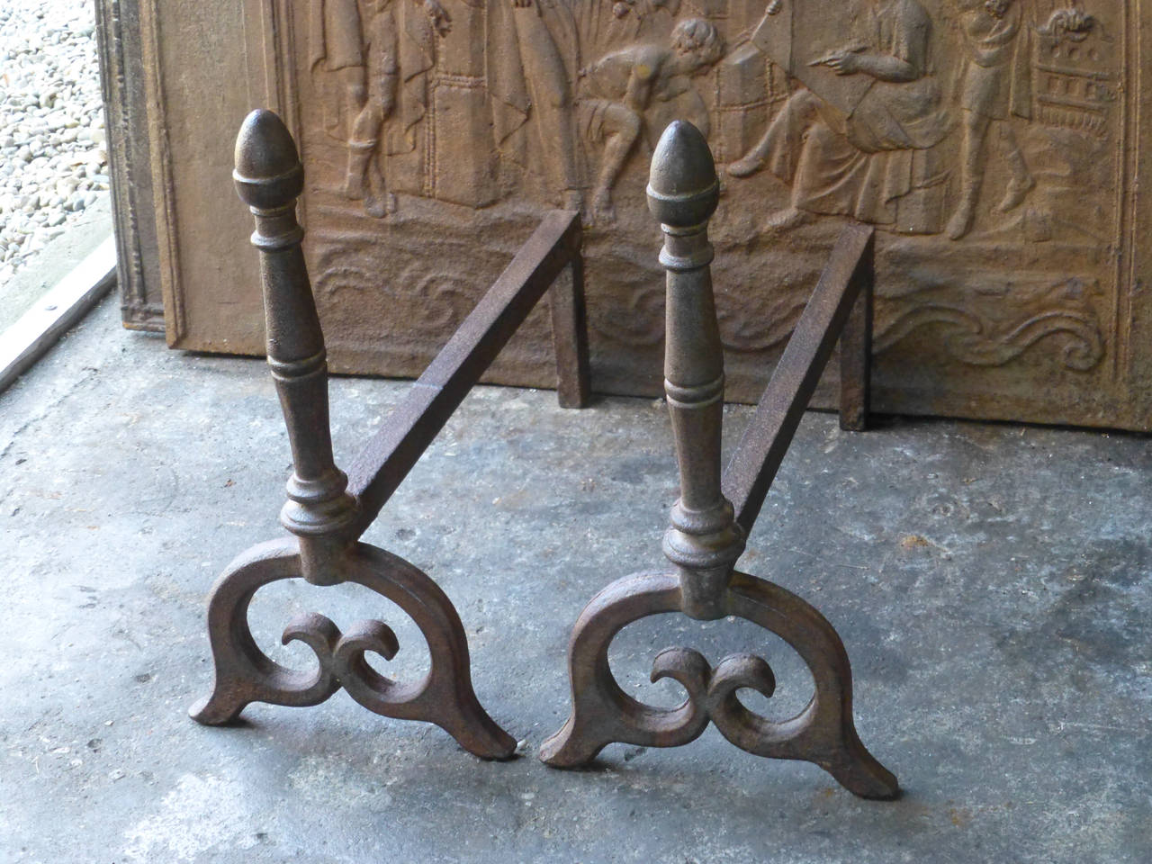 Rare, heavy pair of cast iron andirons or firedogs. 19th Century English Victorian.

We have a unique and specialized collection of antique and used fireplace accessories consisting of more than 1000 listings at 1stdibs. Amongst others we always