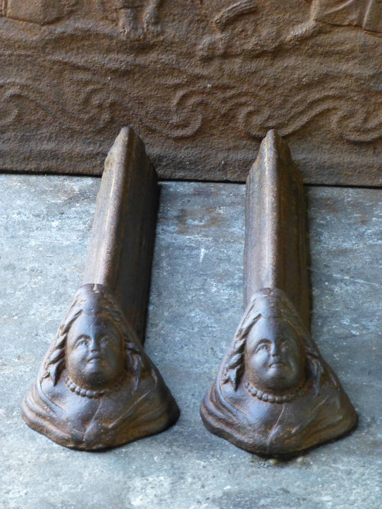 Beautiful and decorative andirons with female front. Louis XV period. Made of cast iron. They are in a good condition.
