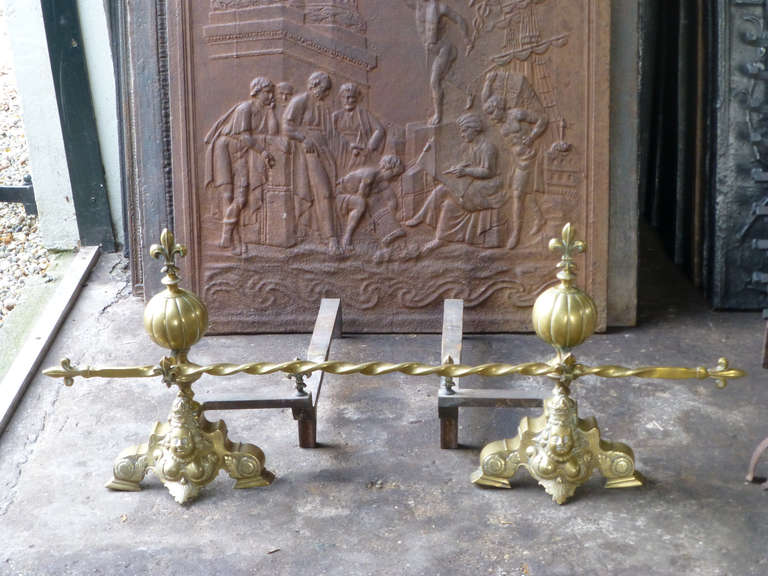 Decorative brass andirons with decorative bar, Louis XIV Style.

We have a unique and specialized collection of antique and used fireplace accessories consisting of more than 1000 listings at 1stdibs. Amongst others, we always have 300+ firebacks,