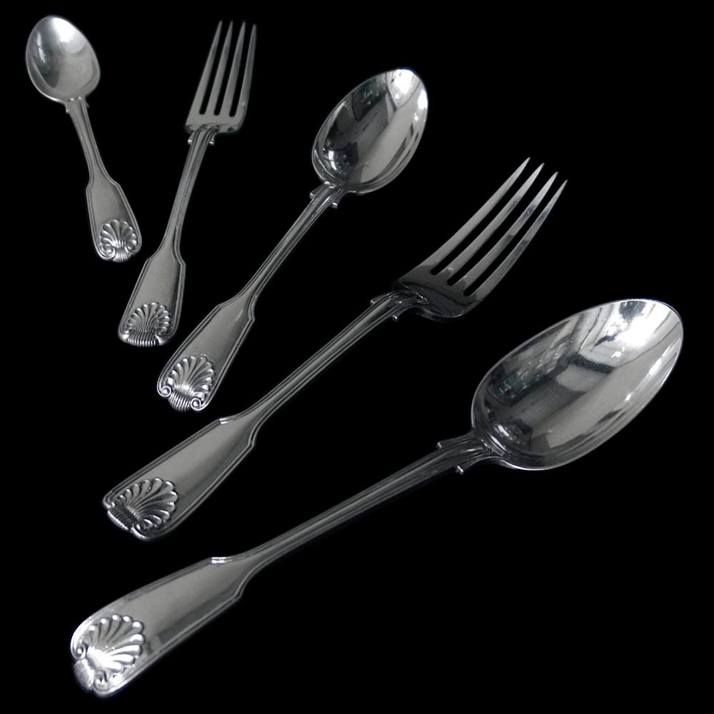 A Victorian silver Fiddle,Thead and Shell flatware for twelve people,all made by George Adams of Chawner & Co.
