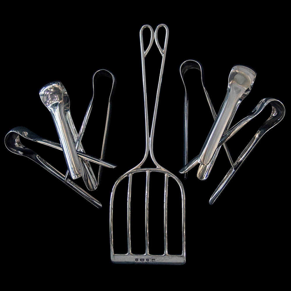 An unusual set of six Edwardian silver asparagus tongs with asparagus server in original presentation case