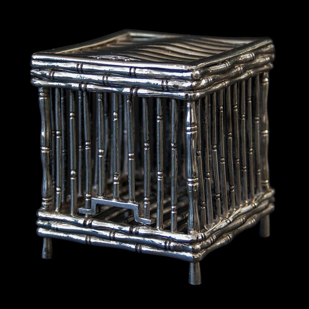 An very interesting minature Chinese Export silver bird cage with sliding cage door. The bars and and frame representing a 'bamboo' structure