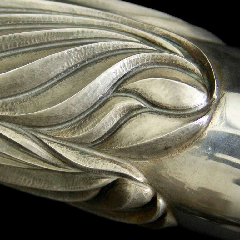 A large silver handcrafted flower vase with fluted decoration 

Signed/inscribed/dated: Birmingham 2012 by Wally Gilbert

Wally Gilbert (circa 1980-2008).