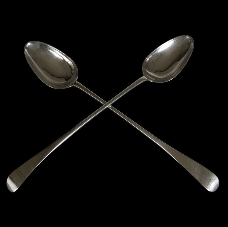 A very nice pair of Scottish sterling silver Old English pattern basting spoons of simple elegant form. <br />
<br />
Signed, Inscribed, Dated: Glasgow, circa 1780 by Adam Graham