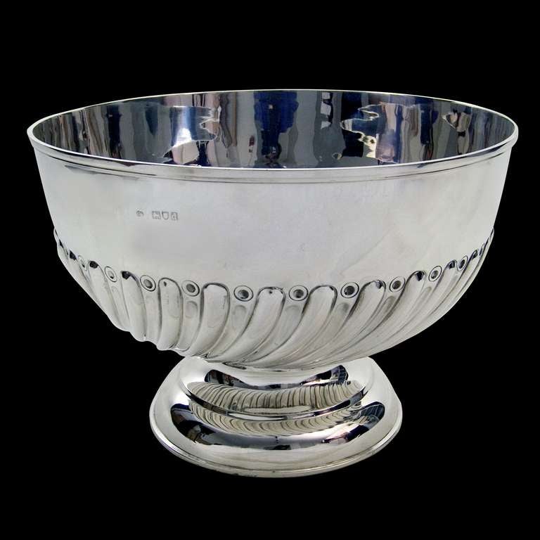 A Victorian silver Rose bowl with half swirl flute decoration on pedestal foot 

Signed/Inscribed/Dated: London 1899 by Charles Boyton