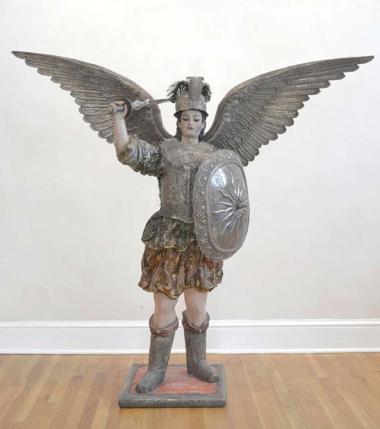 This wonderfully detailed sculpture of the Archangel Michael stands just over 5 feet tall. The Archangel Michael (or simply St. Michael) is often called the avenging angel; as such, he was considered the Captain of the Holy Angels, the defender of