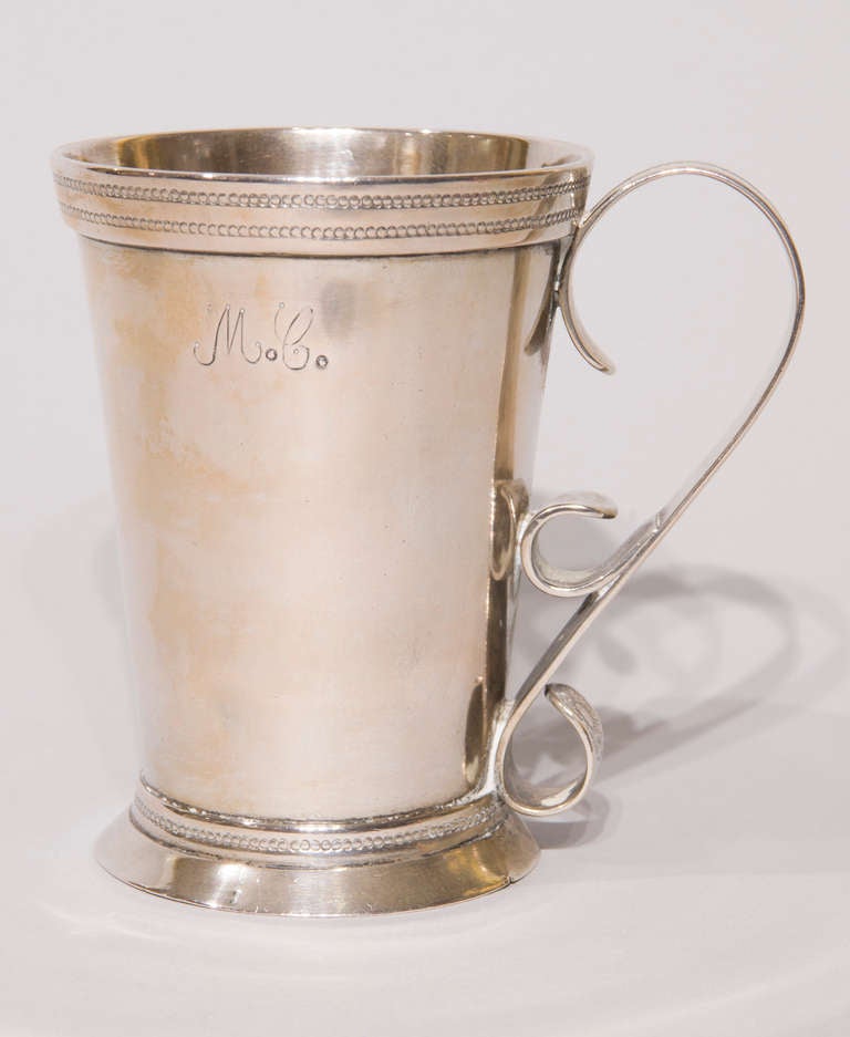 This beautiful Peruvian jarro (mug) is made of annealed and hammered silver and weighs 15.5 ounces/439.43 grams. It was used in the drawing room, dining room and bedroom. On the side of the cup, are the lovely .5 inch engraved initials 