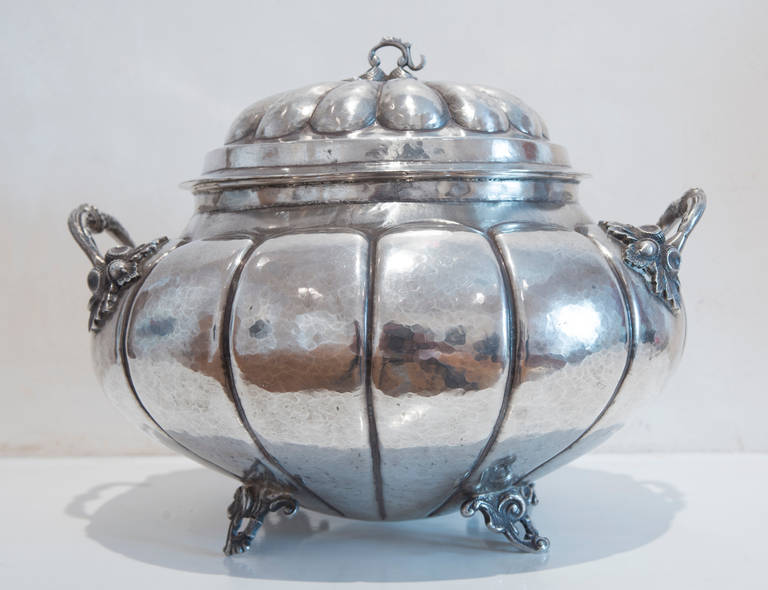 This handsome silver soup tureen features a pumpkin or gourd design with cast leaf scroll handles and feet.  It weighs 80 ounces troy.