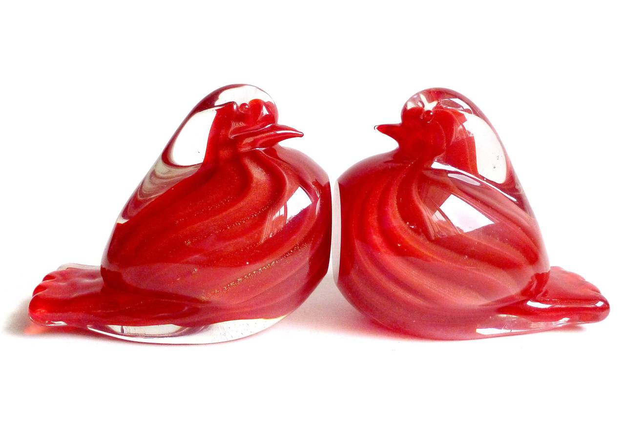 FREE Shipping Worldwide! See details below description.

Elegant set of Murano hand blown striking red and gold flecks art glass dove bird bookend sculptures. Documented to the Archimede Seguso Company. The two birds has a ribbed design, covered