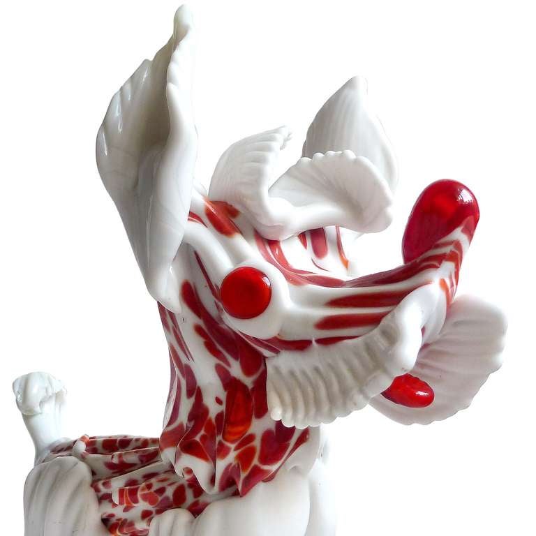 Large and cute Murano hand blown white with red orange spots Italian art glass puppy dog sculpture. The piece dates to the 1960s, with original Murano label on the side. It has applied red eyes, nose and tongue.
