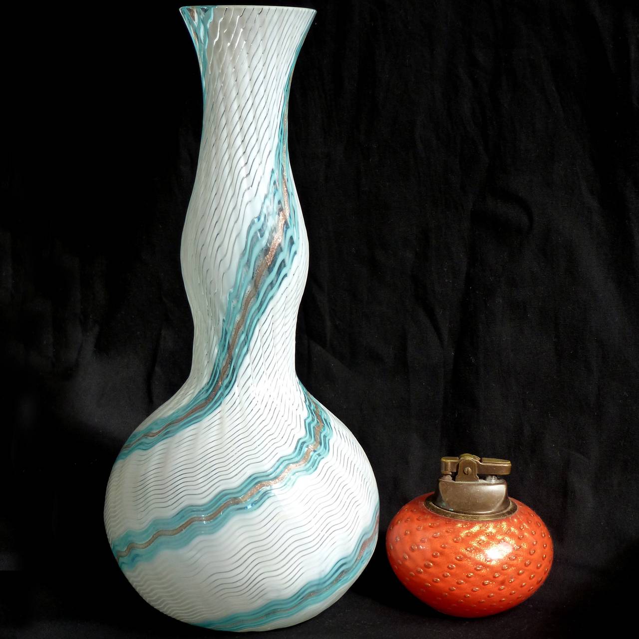 FREE Shipping Worldwide! See details below description.

Amazing Murano Hand Blown Blue, Copper Aventurine Flecks and White Filigrana Ribbons Art Glass Flower Vase. Documented to designer Dino Martens for Aureliano Toso, in the 