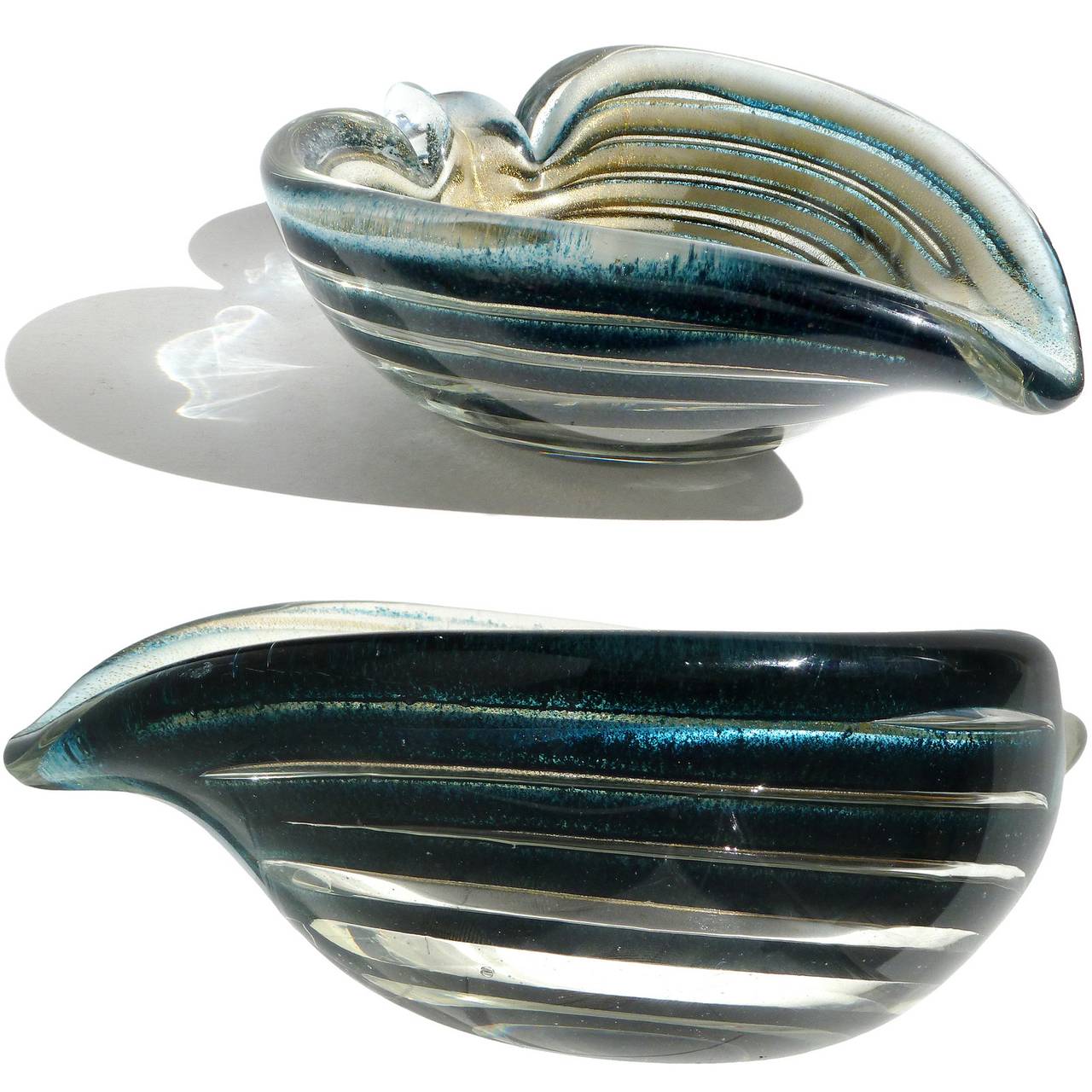 FREE Shipping Worldwide! See details below description.

Rare Murano hand blown dark blue, black, white and gold flecks art glass heart shaped bowl. Documented to designer Ercole Barovier for Barovier e Toso. The piece is made in the 