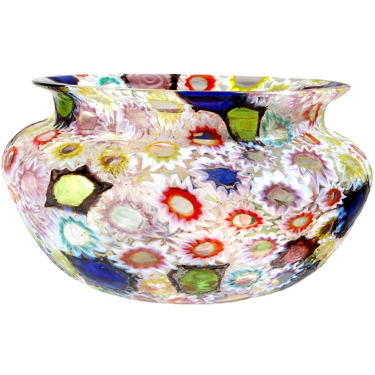 FREE Shipping Worldwide! See details below description.

Incredible Murano multicolor Millefiori flower and star mosaic art glass round bowl. Documented to the Fratelli Toso Company. Many of the murrines are lined in white, but some are lined in a