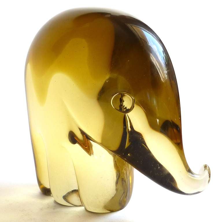 FREE Shipping Worldwide! See details below description.

Large Murano Hand Blown Golden Amber Sommerso Art Glass Elephant Sculpture. Documented to designer Luciano Gaspari for the Salviati company. Very thick and solid piece. 

Please look at my