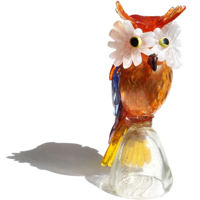 Free Shipping Worldwide! See details below description.

Rare Murano Hand Blown Gold Flecks on Multi Color Feathers Art Glass Owl Sculpture on Pedestal. Attributed to designer Aldo Nason for the A.Ve.M. (Arte Vetraria Muranese) company. The bird