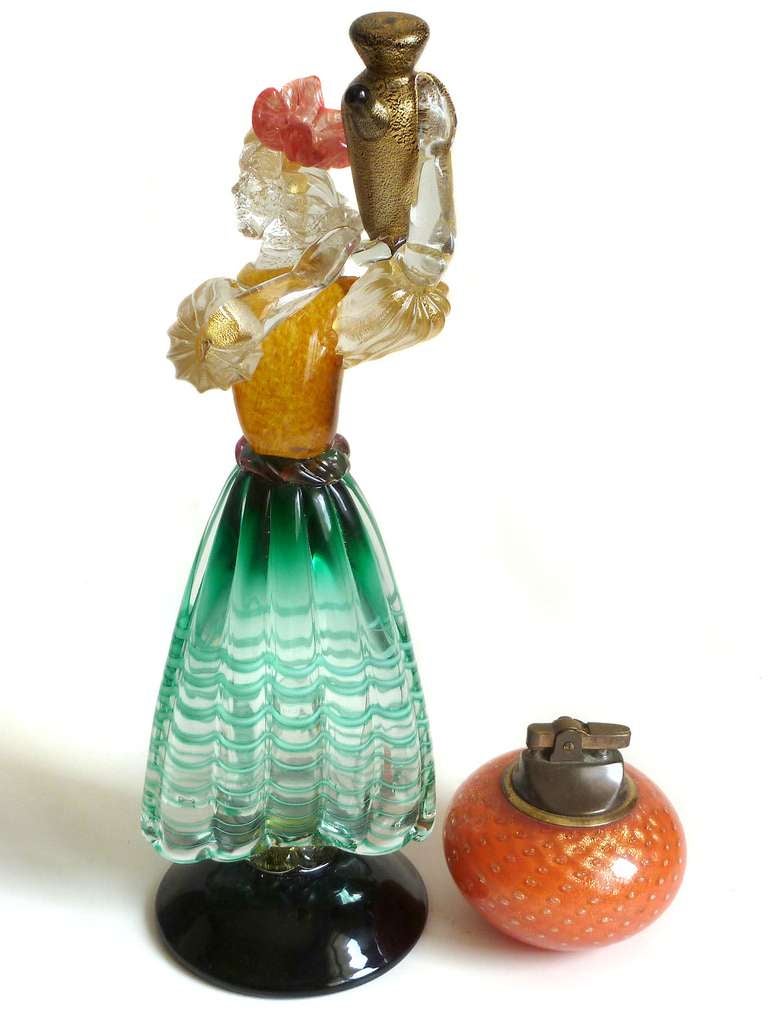 Gorgeous and Elegant Set of 2 Italian Murano Green, Orange and Gold Flecks Art Glass Wine Bearer Women Sculptures. Attributed to Alfredo Barbini for the Salviati Company. The figures have a 
