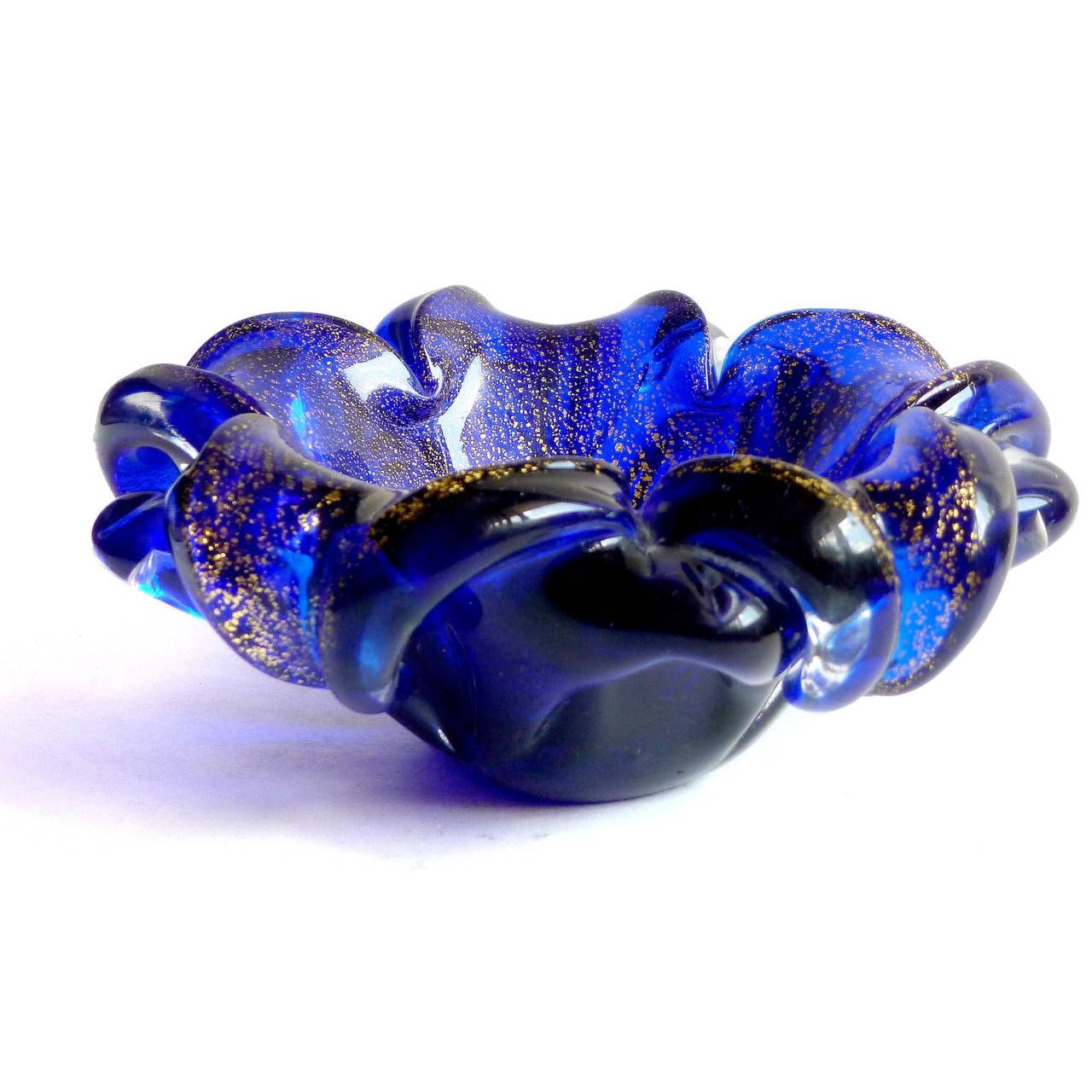 FREE Shipping Worldwide! See details below description.

Beautiful Murano Hand Blown Deep Cobalt Blue and Gold Flecks Art Glass Flower Shaped. Created in the manner of Archimede Seguso. The piece has a double petal design with clear pulled petals