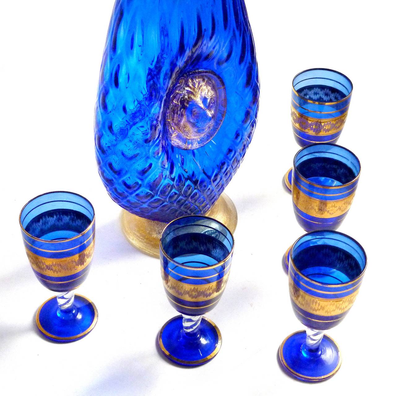 FREE Shipping Worldwide! See details below description.

Gorgeous Murano Hand Blown Rich Sapphire Blue and Gold Flecks Art Glass Lion Head Decanter with Cordials. Documented to the Bischoff liquor company, circa 1950s. The set includes the