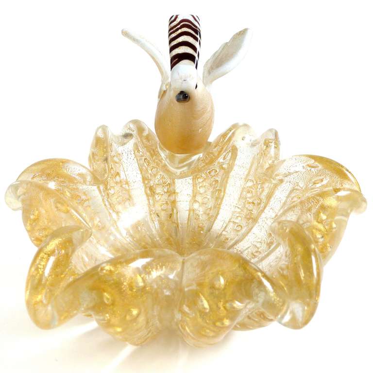 FREE Shipping Worldwide! See details below description.

Rare Murano Hand Blown Gold Flecks Flower Shaped Art Glass Bowl with Attached Bird Figurine. Documented to designer Ercole Barovier for Barovier e Toso. The dish has controlled bubbles,