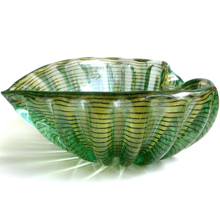 Free Shipping Worldwide! See details below description.

Elegant Murano Hand Blown Green, Gold Flecks and Purple Swirl Art Glass Heart Shaped Bowl. Documented to designer Ercole Barovier for the Barovier e Toso company. It also has a ribbed