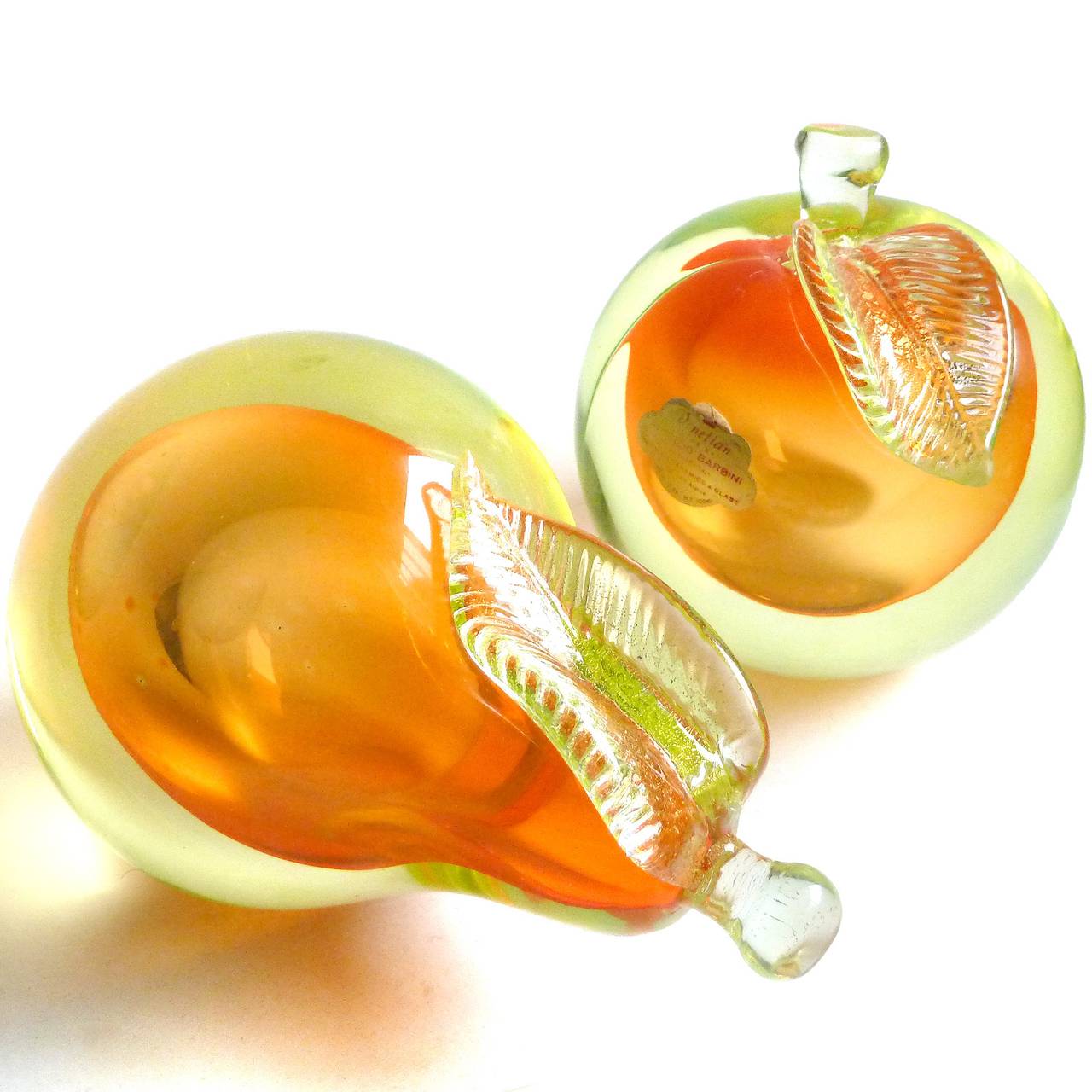 FREE Shipping Worldwide! See details below description.

Beautiful Murano Hand Blown Sommerso Vaseline Yellow, Orange and Gold Flecks Art Glass Pear and Apple Fruit Bookends. Documented to designer Alfredo Barbini, circa 1950-60s and published in