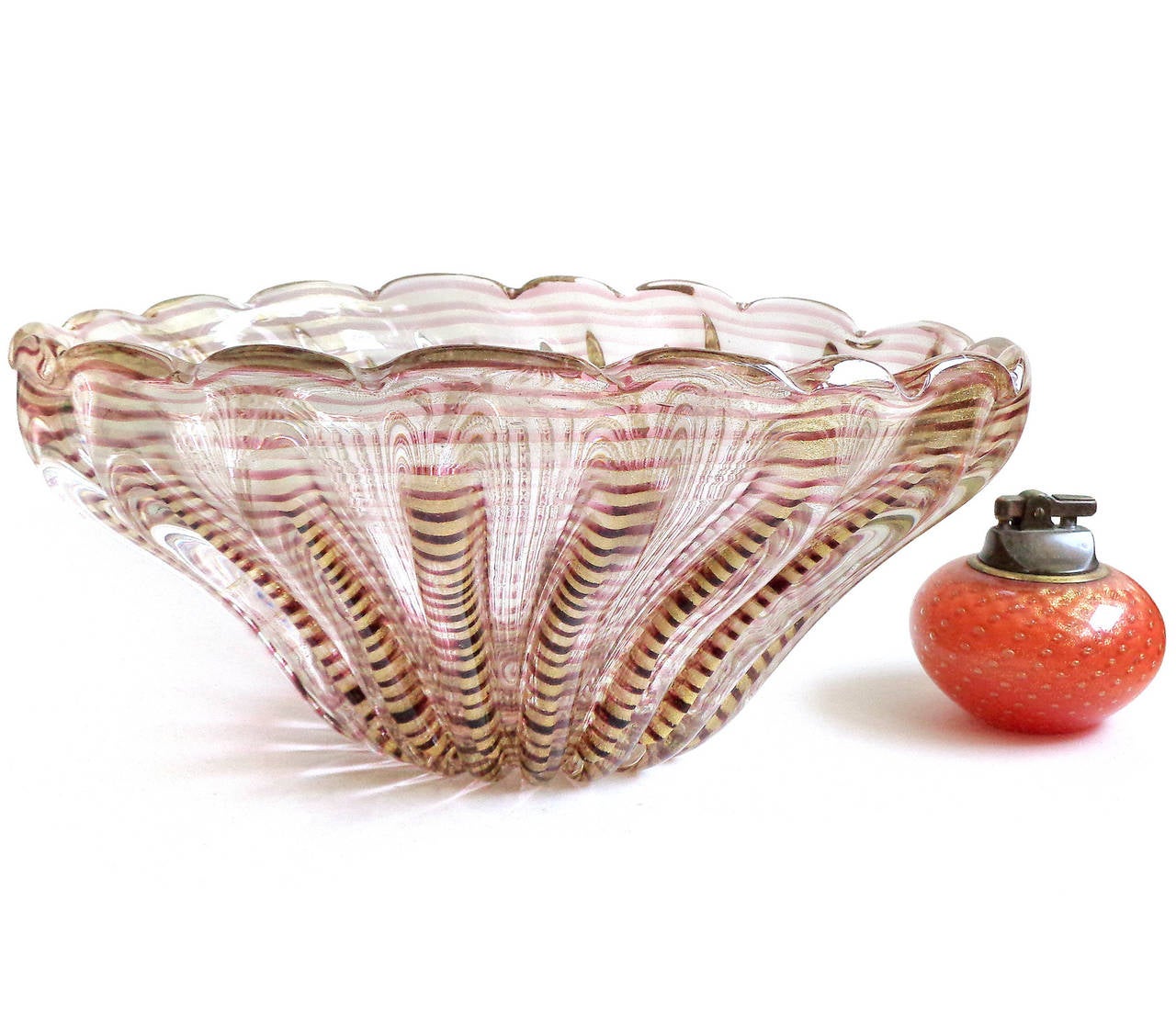 Free shipping Worldwide! See details below description.

Gorgeous, rare and very large Murano handblown purple striped and gold flecks art glass center bowl. Documented to designer Ercole Barovier, for the Barovier e Toso company. Created in the