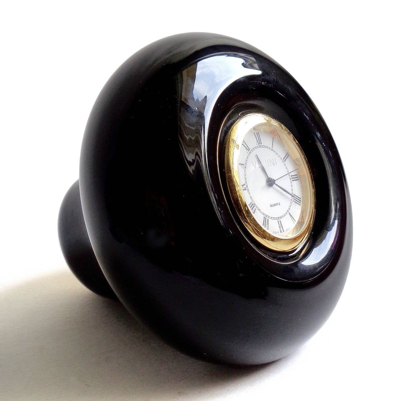 FREE Shipping Worldwide! See details below description.

Gorgeous Murano Hand Blown Jet Black Art Glass Paperweight Desk Clock. The piece is signed Venini 99, with Venini on the clock face and original label on the side. The clock works very well,