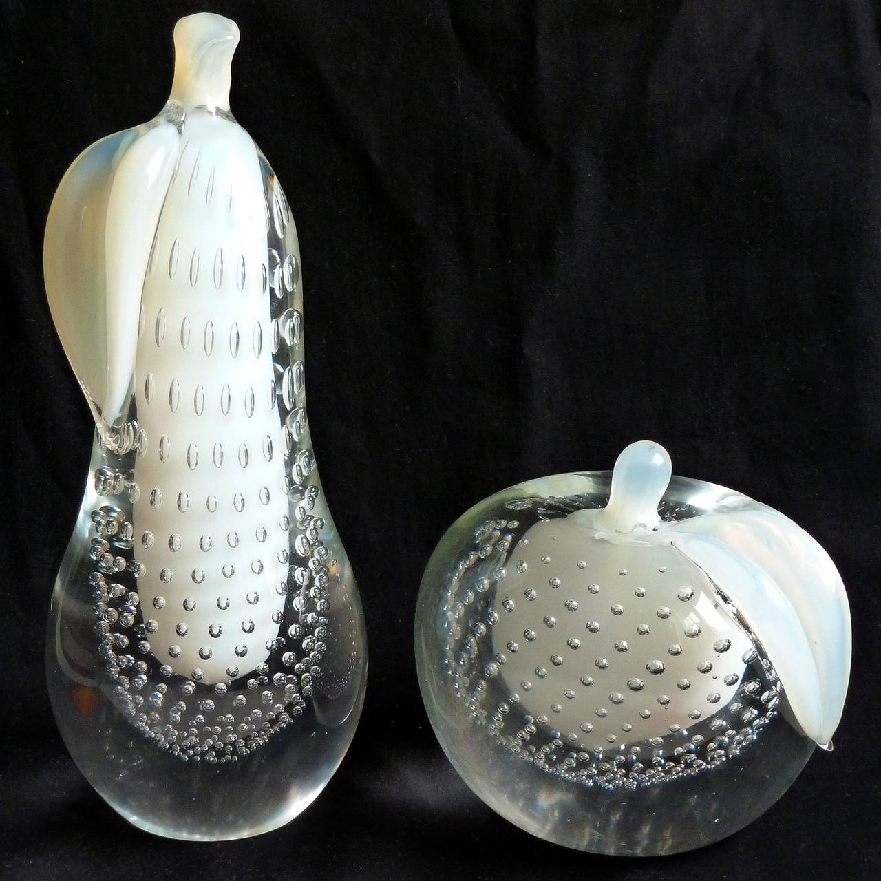 Free shipping worldwide! See details below description.

Elegant set of Murano hand blown opalescent white and controlled bubbles art glass apple and pear sculptures. Documented to the Salviati Company, circa 1960-1970s. The two pieces are very