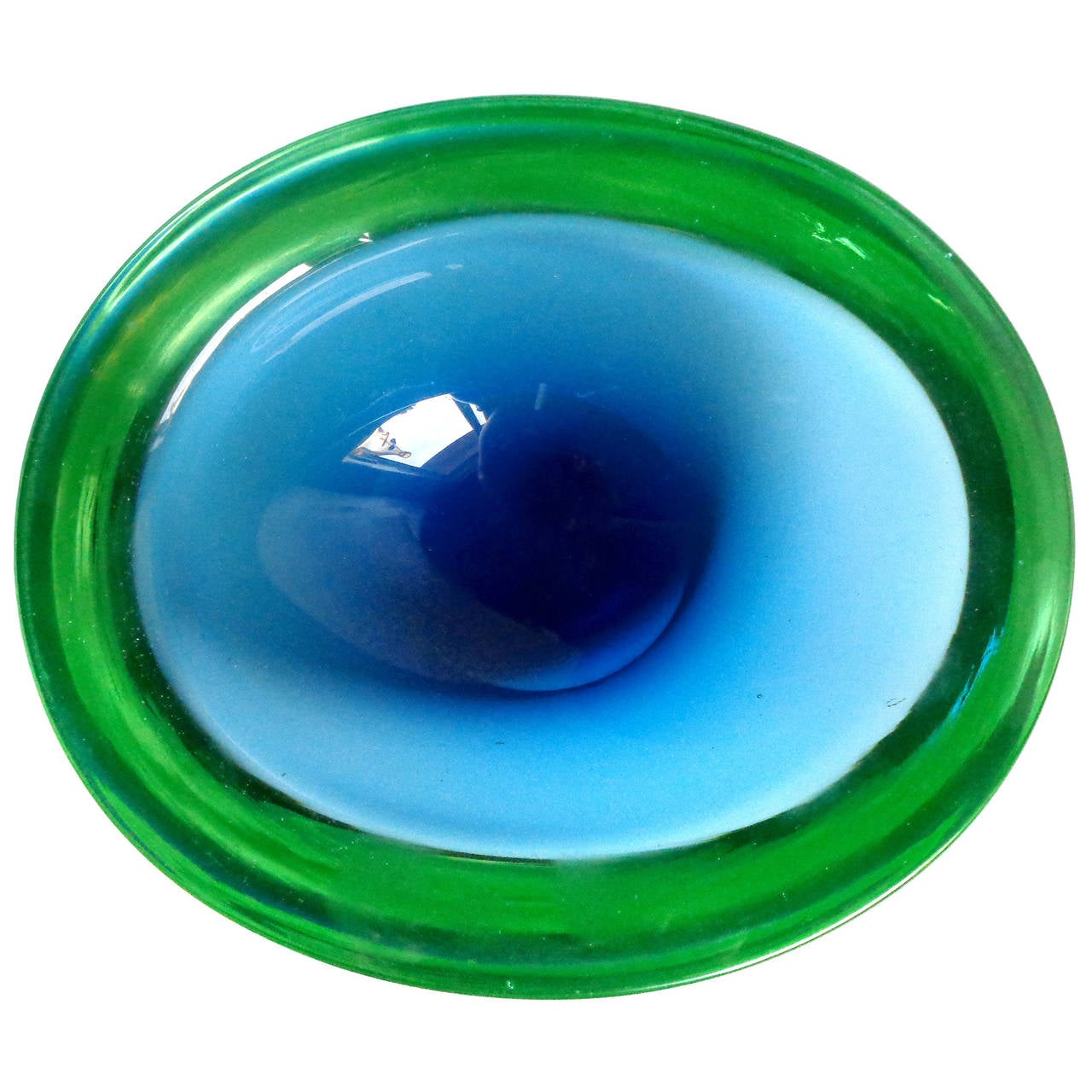 FREE Shipping Worldwide! See details below description.

Beautiful Murano Hand Blown Blue and Green Sommerso Art Glass Oval Shaped Bowl. Created in the manner of the Seguso company. Very think piece with a 1