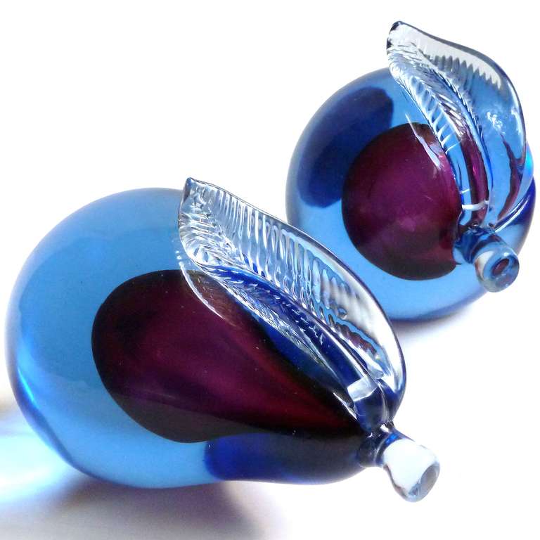 Free Shipping Worldwide! See details below description.

Beautiful Murano Hand Blown Sommerso Blue over Purple Art Glass Pear and Apple Fruit Bookends. Documented to designer Alfredo Barbini, circa 1950-60s and published in his vintage catalogs.