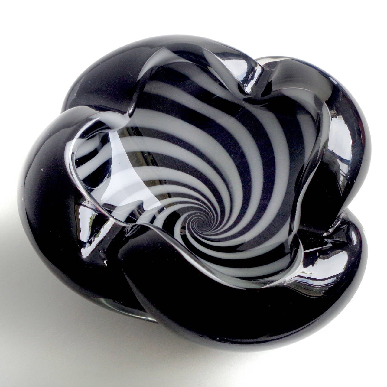 Free shipping worldwide! See details below description.

Gorgeous and unusual Murano handblown black and white optic swirl art glass decorative bowl. Attributed to designer Alfredo Barbini. The piece has a psychedelic design, and made with thick