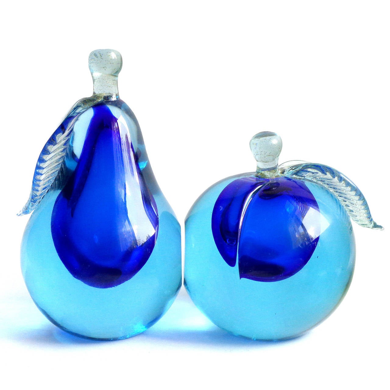 Free shipping worldwide! See details below description.

Gorgeous Murano hand blown, Sommerso light blue over cobalt blue art glass pear and apple fruit bookends. Documented to designer Alfredo Barbini, circa 1950-1960s and published in his