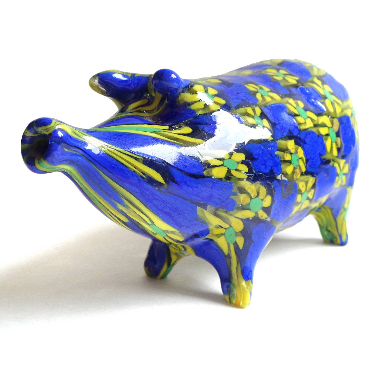 FREE Shipping Worldwide! See details below description.

Colorful and unusual Murano hand blown millefiori yellow and blue flowers art glass pig figurine. Documented to the Fratelli Toso company. The figurine is very well detailed, even with a