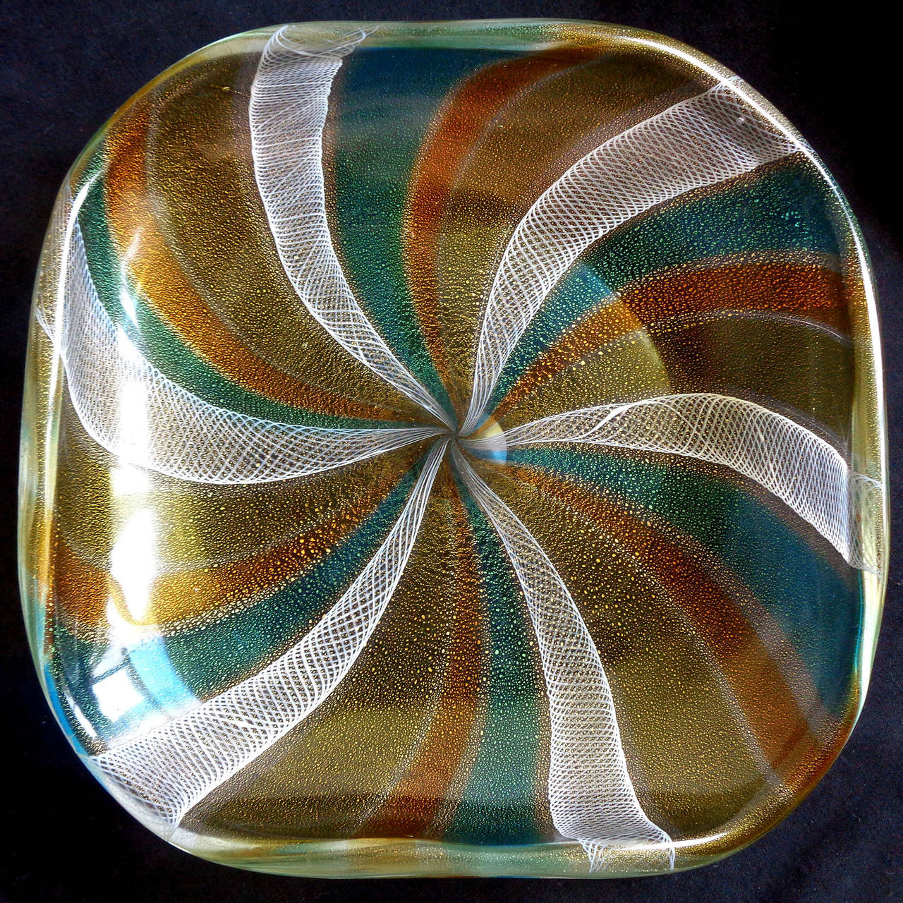 Free shipping worldwide! See details below description.

Amazing Murano handblown blue, orange and yellow pinwheel bowl with zanfirico ribbons and gold. Beautiful design, and profusely covered in gold leaf. 

Please look at my exclusive 1stdibs