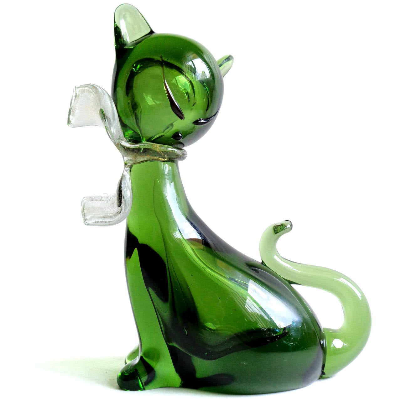 Free shipping worldwide! See details below description.

Adorable Murano hand blown Sommerso forest green and gold flecks art glass kitty cat figurines. Documented to designer Alfredo Barbini, for Weil Ceramics and Glass. Both have gold leaf bows