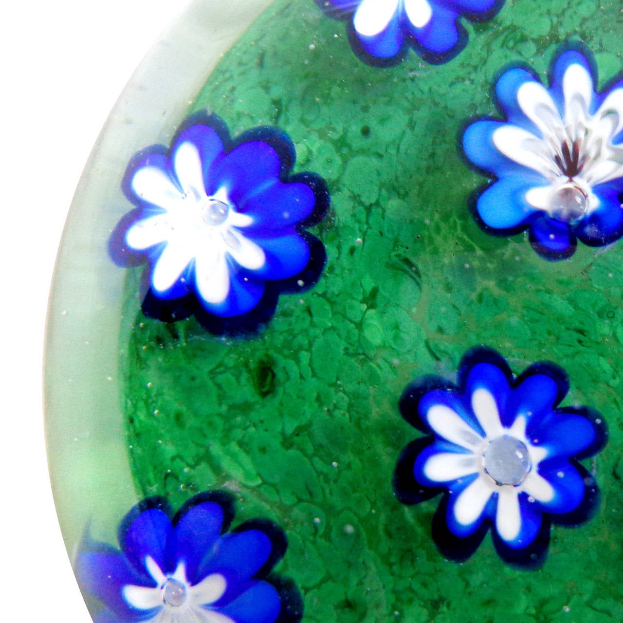 Free shipping worldwide! See details below description.

Gorgeous set of Murano hand blown red and blue millefiori flower garden paperweights. Attributed to designer Galliano Ferro. The flowers grow out of a bed of green, just beautiful! Blue