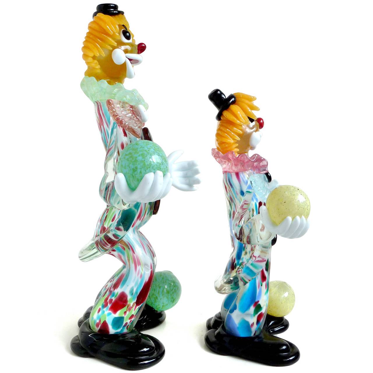 FREE Shipping Worldwide! See details below description.

Very cute Murano hand blown, multi-color confetti design, art glass juggling clown pair. The figures are juggling 2 balls each, one in hand and another on the foot. Referred to as 