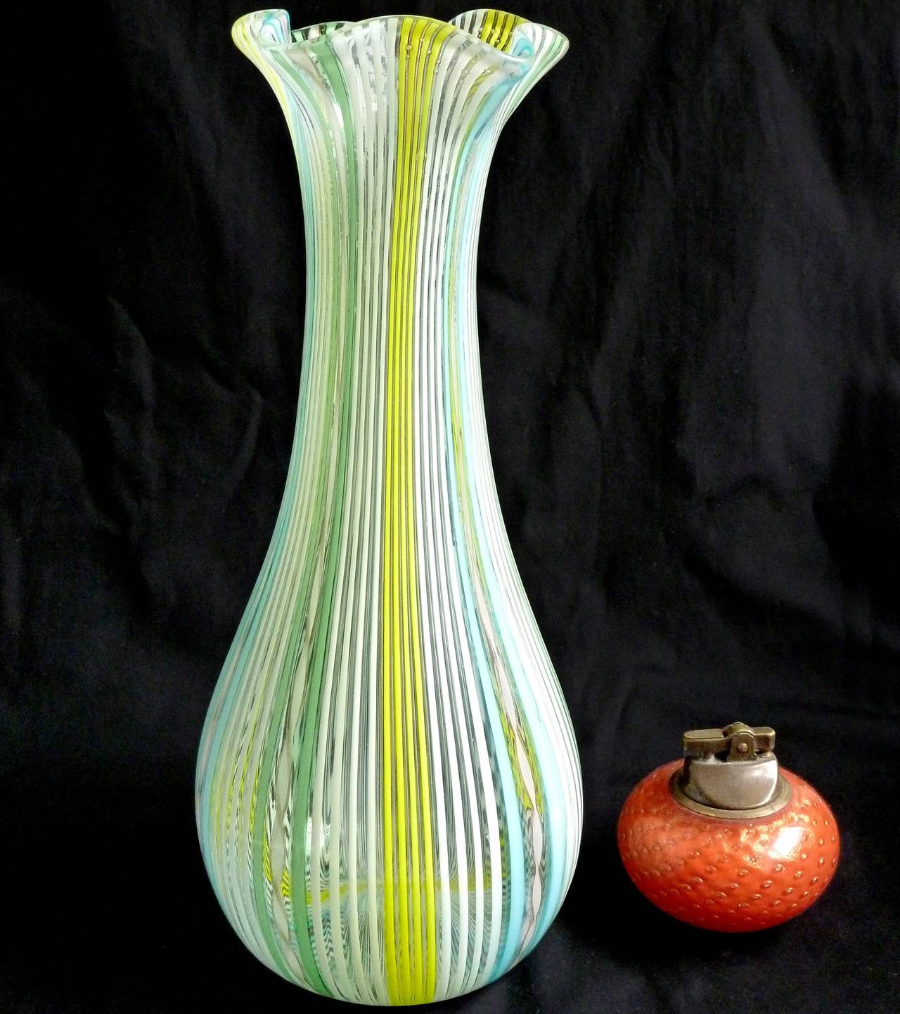 FREE Shipping Worldwide! See details below description.

Large and Beautiful Murano Hand Blown Filigrana and Zanfirico Ribbons Art Glass Flower Vase. Attributed to designer Dino Martens for Aureliano Toso. The rim is crimped to form a flower