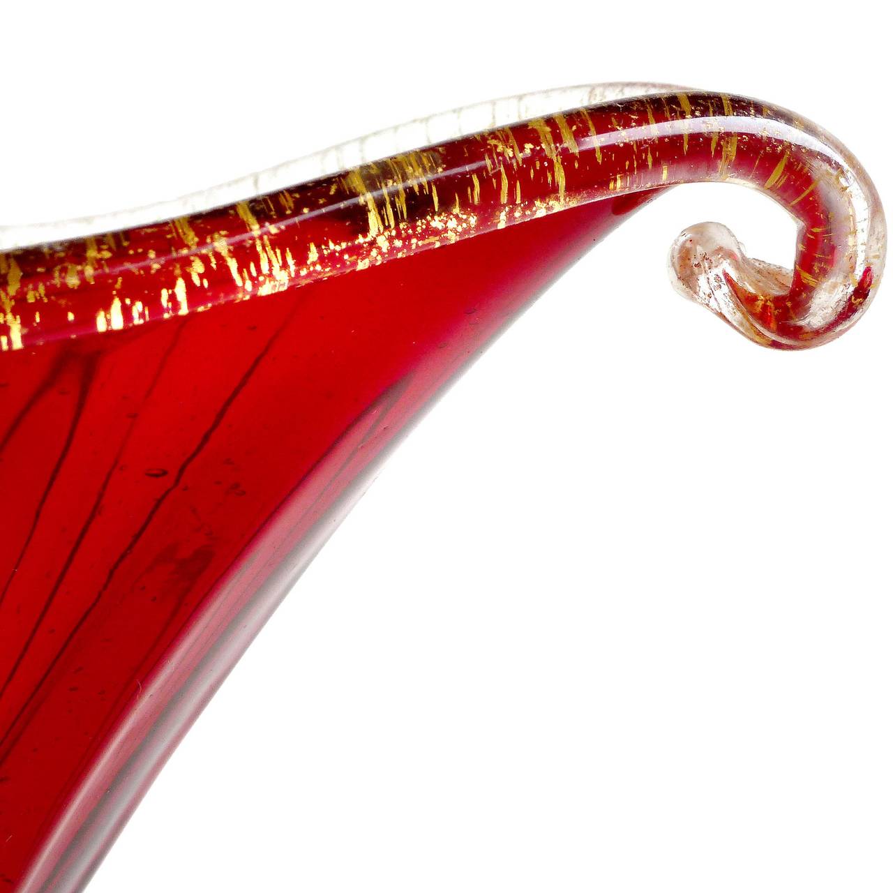 FREE Shipping Worldwide! See details below description.

Beautiful Murano Hand Blown Red and Gold Flecks Gondola Shape Bowl or Candy Dish. Attributed to the Barovier e Toso company. The piece has been lined with a gold band all around the rim, and