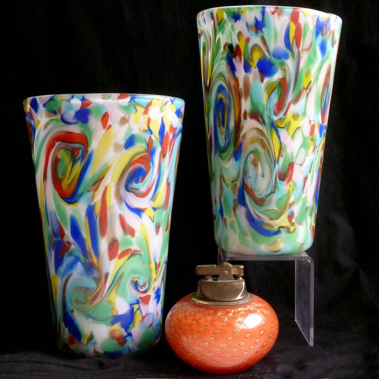 FREE Shipping Worldwide! See details below description.

Beautiful and Colorful Murano Hand Blown Rainbow Color Swirls over White Art Glass Flower Vases. Documented to the Fratelli Toso company, in the 