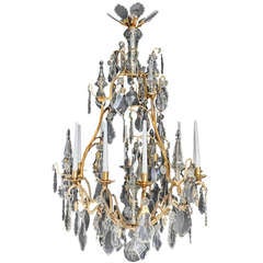 A Louis Xv Style Bronze And Crystal 9 Light Chandelier