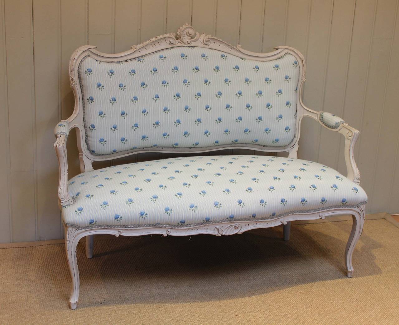 French painted Louis XVI style canape settee having a painted carved frame raised on cabriole legs and freshly upholstered