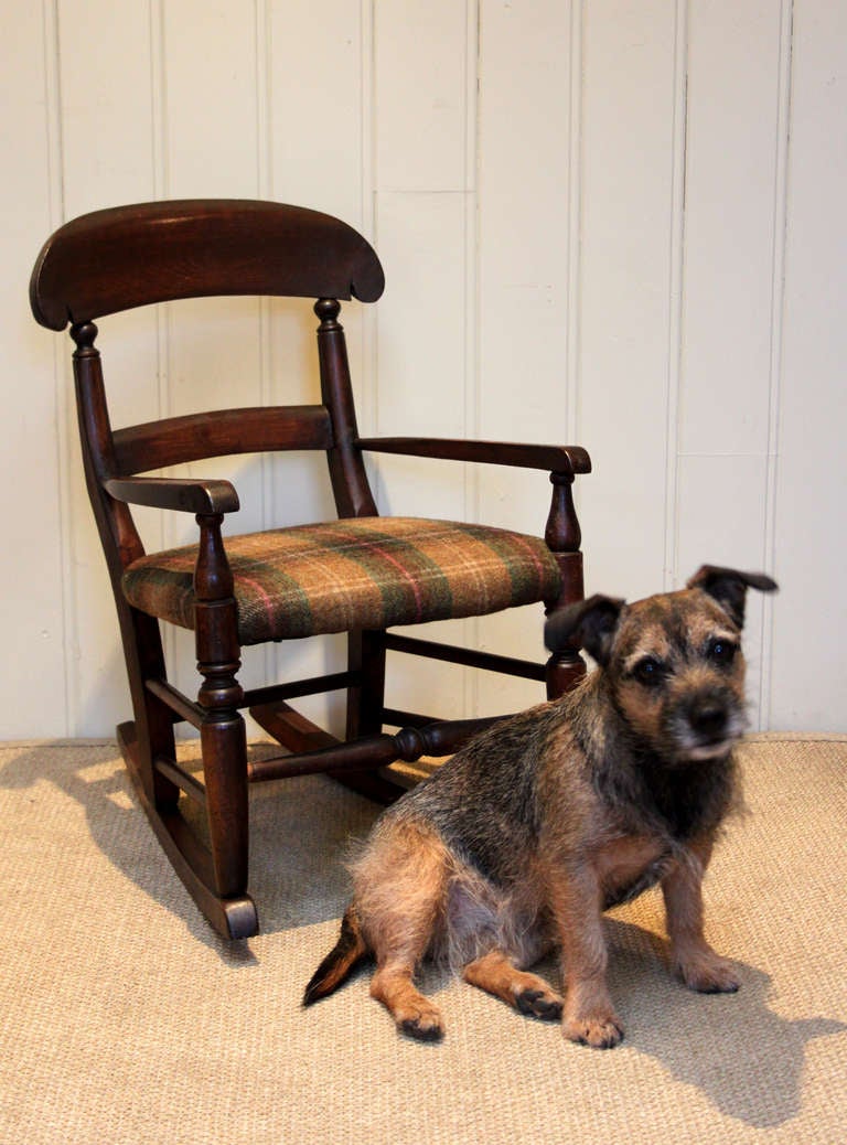 Mid 19th century beechwood framed childs rocking chair reupholstered in a tweed fabric