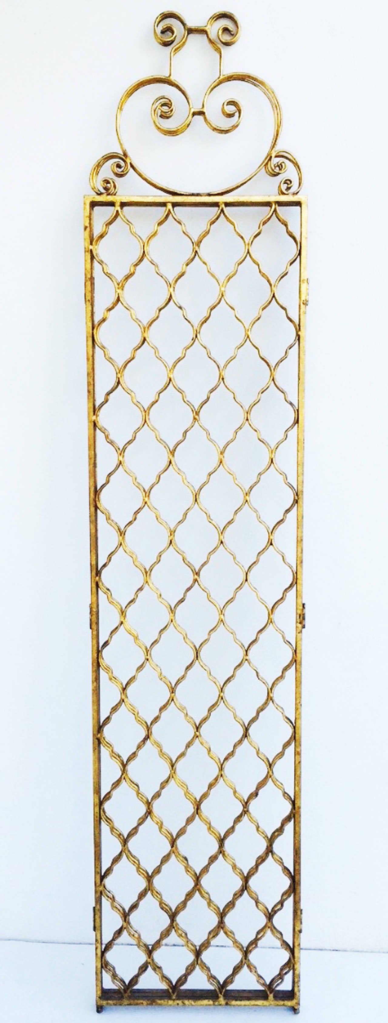 A chic vintage gilt metal folding screen/room divider. Authentic Italian gilt metal item features three hinged panels (76.5