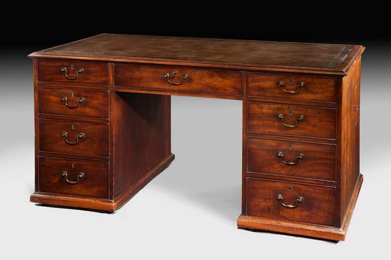 A most unusual late George II period mahogany pedestal desk, with unusual cellaret drawer and side glasses compartment. 
 This one piece pedestal desk or library table is of superb quality and undoubtedly made in a distinguished London workshop.