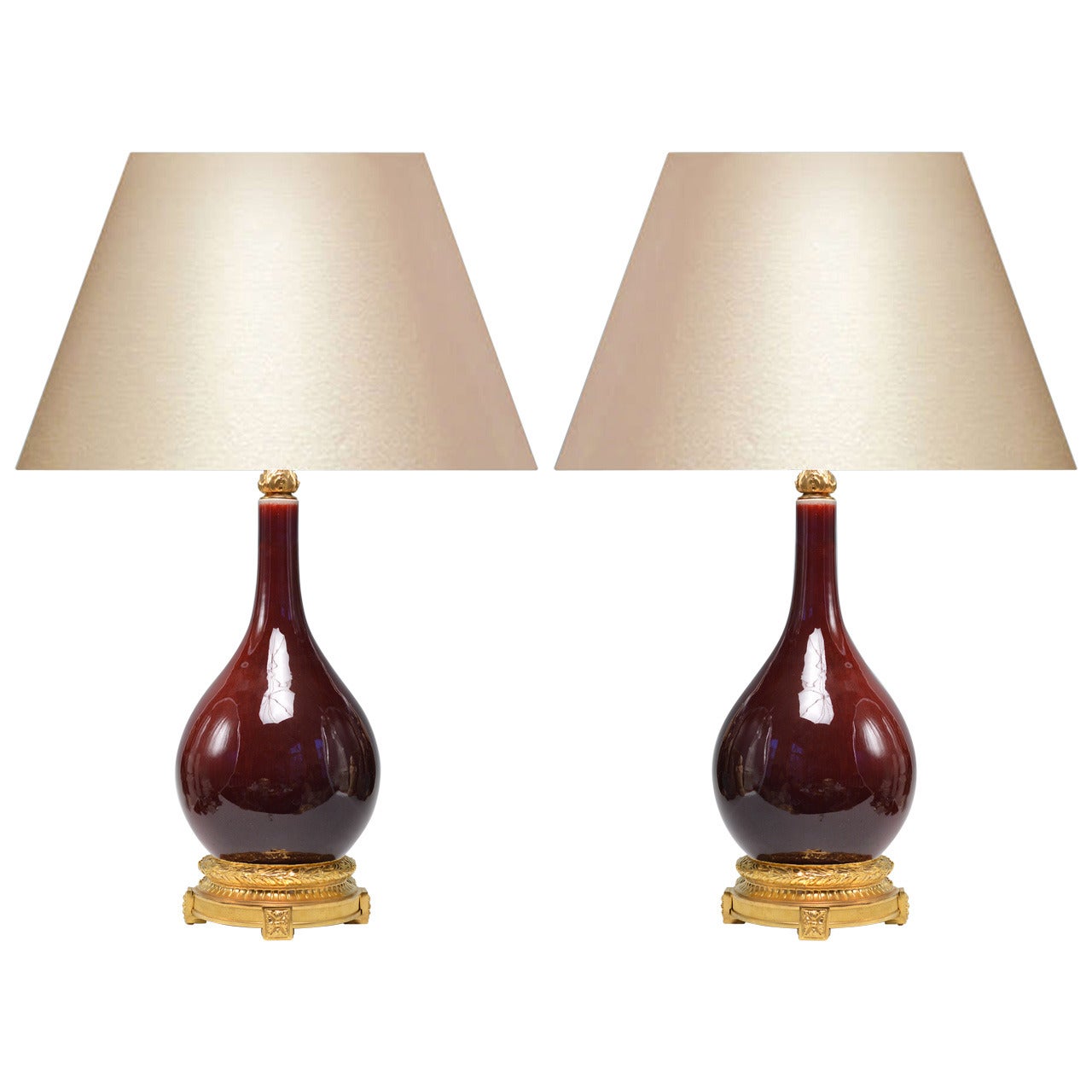 Pair of Copper Red-Glazed Porcelain Lamps with Gilt Bronze Bases