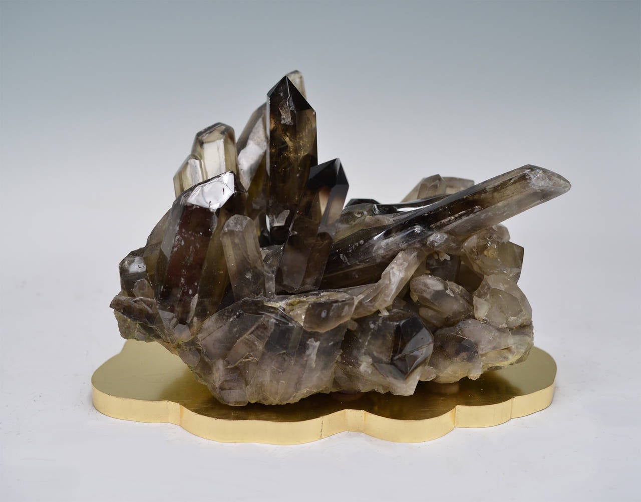 Smoky brown rock crystal, quartz cluster sculpture on gilt base.