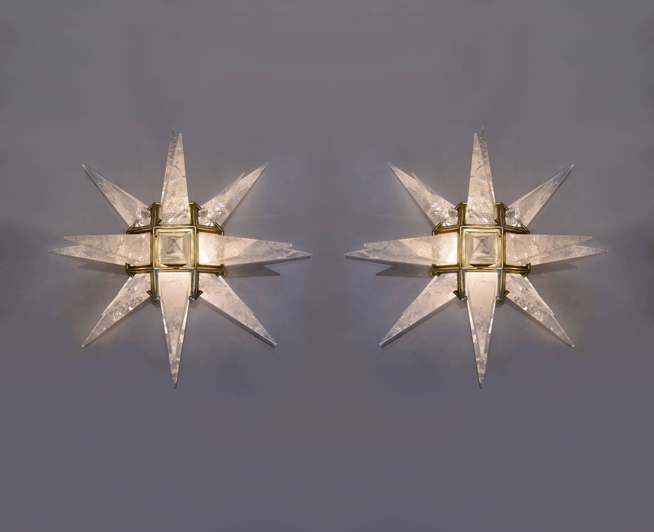A fine carved star form rock crystal wall sconce with antique brass finished frame, created by Phoenix Gallery, NYC.
Available in nickel plating frame.